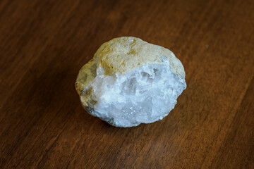 A piece of clear crystal in a piece of stone.
