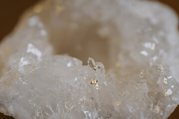 A piece of clear crystal in a piece of stone.
