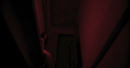 Horror scene of a mysterious Scary Asian ghost woman creepy have hair covering the face sitting on...