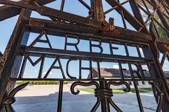 DACHAU MEMORIAL, GERMANY - AUGUST 15, 2017: iconic gate at the entrance of nazi concentration camp with slogan "Arbeit Macht Frei", meaning "Labor sets free"