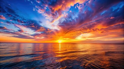 Fototapeta premium Vibrant sunset casting a warm glow over the calm sea , sunset, sea, ocean, water, sky, clouds, horizon, evening, twilight