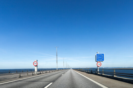 Highway road to Denmark with a sign about crossing the border of Denmark. High quality photo