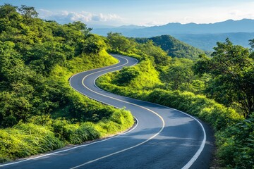 Winding Asphalt Road Through Lush Green Mountain Landscape