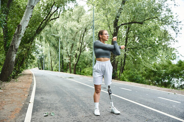 A young woman in sportswear actively exercising outdoors, embracing fitness with determination.