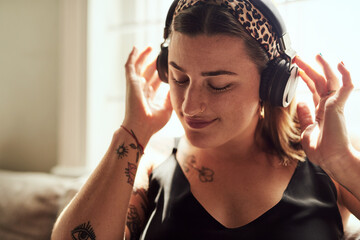 Relax, music and woman with headphones, lounge and chilling with radio, streaming and comfortable....