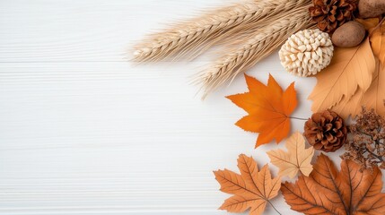 Fototapeta premium Autumn leaves and pinecones on white wooden background