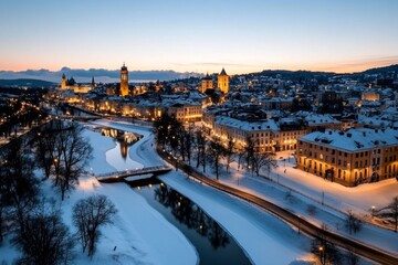 Snow-covered Old Town of Vilnius, Lithuania, with warm lights glowing from medieval buildings