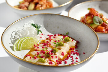 Gourmet Scallop Ceviche Plate with Fresh Lime and Vibrant Garnishes