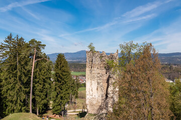 Obraz premium Panoramic view of castle ruins of Burgruine Altrosegg on hilltop in Rosegg, Rosental, Carinthia, Austria. Surrounded by scenic alpine landscape on sunny spring day in Austrian Alps. Historical decay