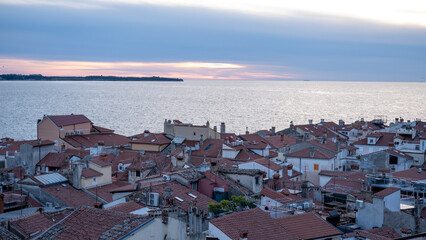 Italy old town skyline in the Mediterranean Sea during dusk., Slovenian city, sunset at the evening
