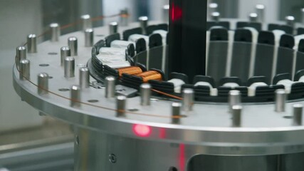 Precision Manufacturing: Close-up of an Automated Assembly Line Precisely Aligning and Securing Components on a Rotating Platform, Demonstrating Advanced Manufacturing Technology - Powered by Adobe