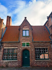 Obraz premium Romantic Facades of Brugge: Exploring Belgium's Medieval Architecture and Picturesque Brick Houses