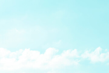 Blue pastel sky with white fluffy cloud. Cumulus clouds background. Cloudscape morning sky. The concepts of freedom of life, never give up and positive though energy.	