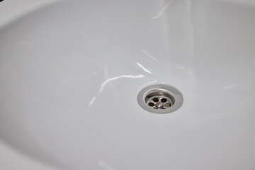 Effectively Hand Cleaning a Sink Using a Sponge and Gloves for Optimal Cleanliness
