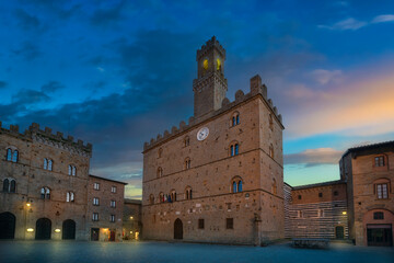 Volterra, medieval palace Palazzo Dei Priori at sunset. Tuscany, Italy