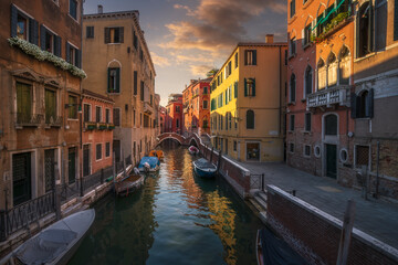 Fototapeta premium Venice cityscape, canal and two bridge in Calle Ramo va in Campo. Italy