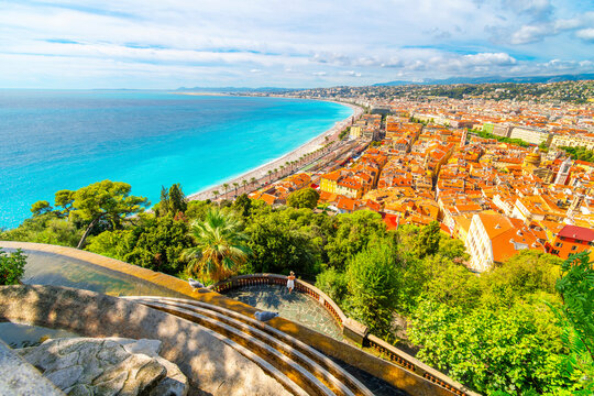 View from atop the Colline du Ch&acirc;teau manmade waterfall on Castle Hill overlooking the Bay of Angels turquoise sea, Vieux Ville Old Town and Promenade des Anglais, Nice France, French Riviera.