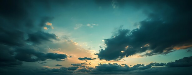 Fototapeta premium Tropical sunset. Beautiful sunset sky with clouds. Orange sunset, dark clouds in sky. Background of dark clouds before storm. Dramatic clouds. Apocalyptic sky, dark cloud. Overcast background