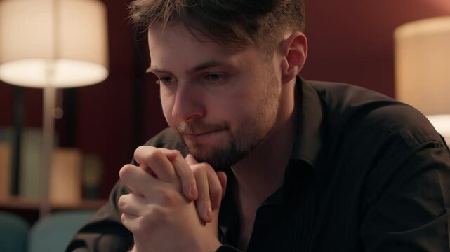 Worried pensive experienced Caucasian male man guy player gamer gambler preparing playing poker card game think strategy betting rubbing hands gambling casino addiction indoors home weekend nightlife