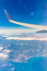 View from the airplane window of the mountains and sea resort with corals in Egypt, Sharm El Sheikh.Flight