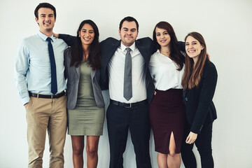 Fototapeta premium Portrait, hug and group of happy business people together for solidarity, integrity or about us. Smile, collaboration or staff embrace for diversity, support and sales team on white studio background