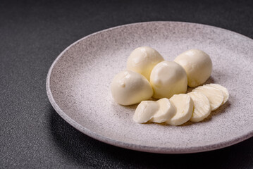 Delicious fresh mozzarella cheese with tomatoes, salt and spices