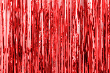 Red foil strip background. Curtain hanging on wall. Festive, Christmas, New Year or anniversary party concept. Decorative wallpaper