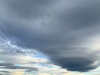 Cloudy sky with Lenticular clouds on windy weather - natural background. Topics: wind, meteorology,...
