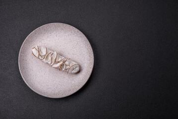 Sweet eclair with custard decorated with coconut slices