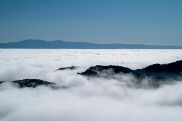 Mountain peaks above the clouds