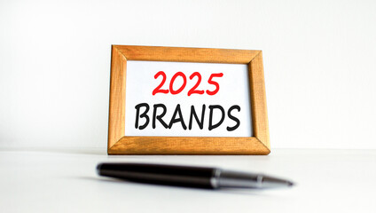 Planning 2025 brands new year symbol. Concept words 2025 Brands on beautiful wooden picture frame. Beautiful white background. Black pen. Business 2025 brands new year concept. Copy space.