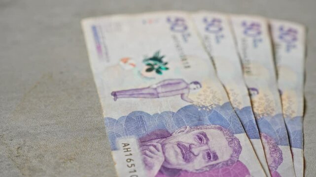 Colombian banknotes of 50 pesos on a concrete surface highlighting the currency and the country of origin.
