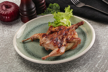 Grilled quail in the plate