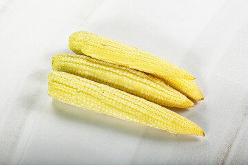 Raw sweet baby corn heap