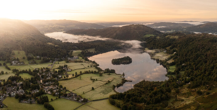 Aerial view of the lake District village of Grasmere and lake at sunset