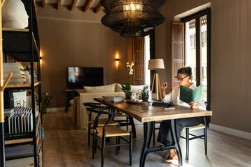 Businesswoman over 50 years old working in her modern interior design studio.