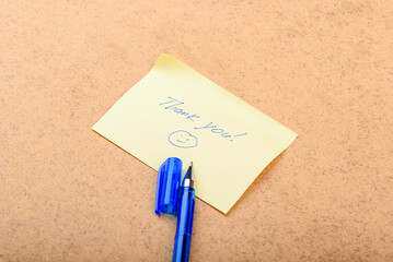 A handwritten note saying Thank you with a smiley face.