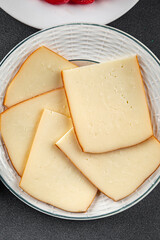 Raclette cheese tasty food dish fresh delicious gourmet food background on the table rustic food top view copy space top view