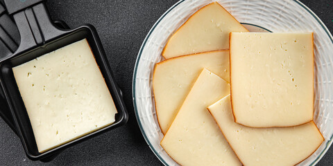 Raclette cheese tasty food dish fresh delicious gourmet food background on the table rustic food top view copy space top view