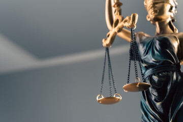 The woman with the scales of justice