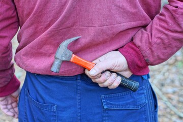 one small industrial professional nail puller iron with black rubber handle old hand rusty hammer...