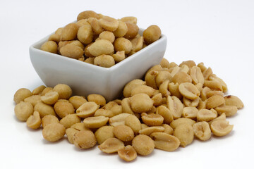 Salted peanuts heap on white