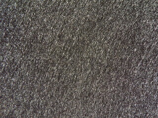 The textured surface is gray as a background. Felt