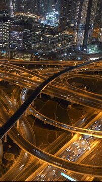A breathtaking Aerial View showcasing the intricate Urban Highway Network illuminated at Night