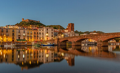 Beautiful view of the town of Bosa after sunset, island of Sardinia, Italy.