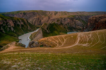 Obraz premium Crocodile Bay, one of the scenic areas in Kalajun Grassland, located in the middle of the Kuokesu Grand Canyon, Tekes County, Ili Kazakh Autonomous Prefecture, Xinjiang, China