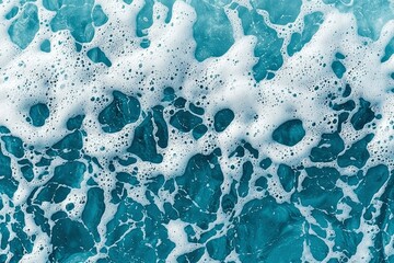Naklejka premium Abstract Closeup of White Sea Foam on Blue Water
