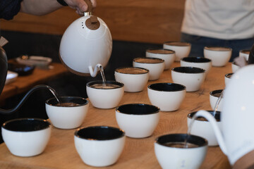 water being poured for a coffee cupping