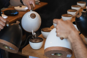water being poured for a coffee cupping