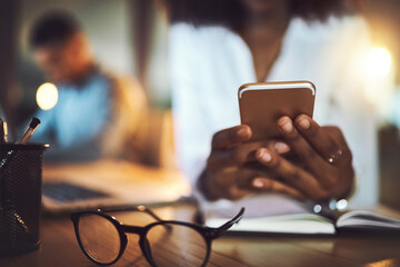 Woman, hands and phone in office for business research, communication and writing client feedback. Employee, closeup and mobile in workplace at night for networking, text message and project approval